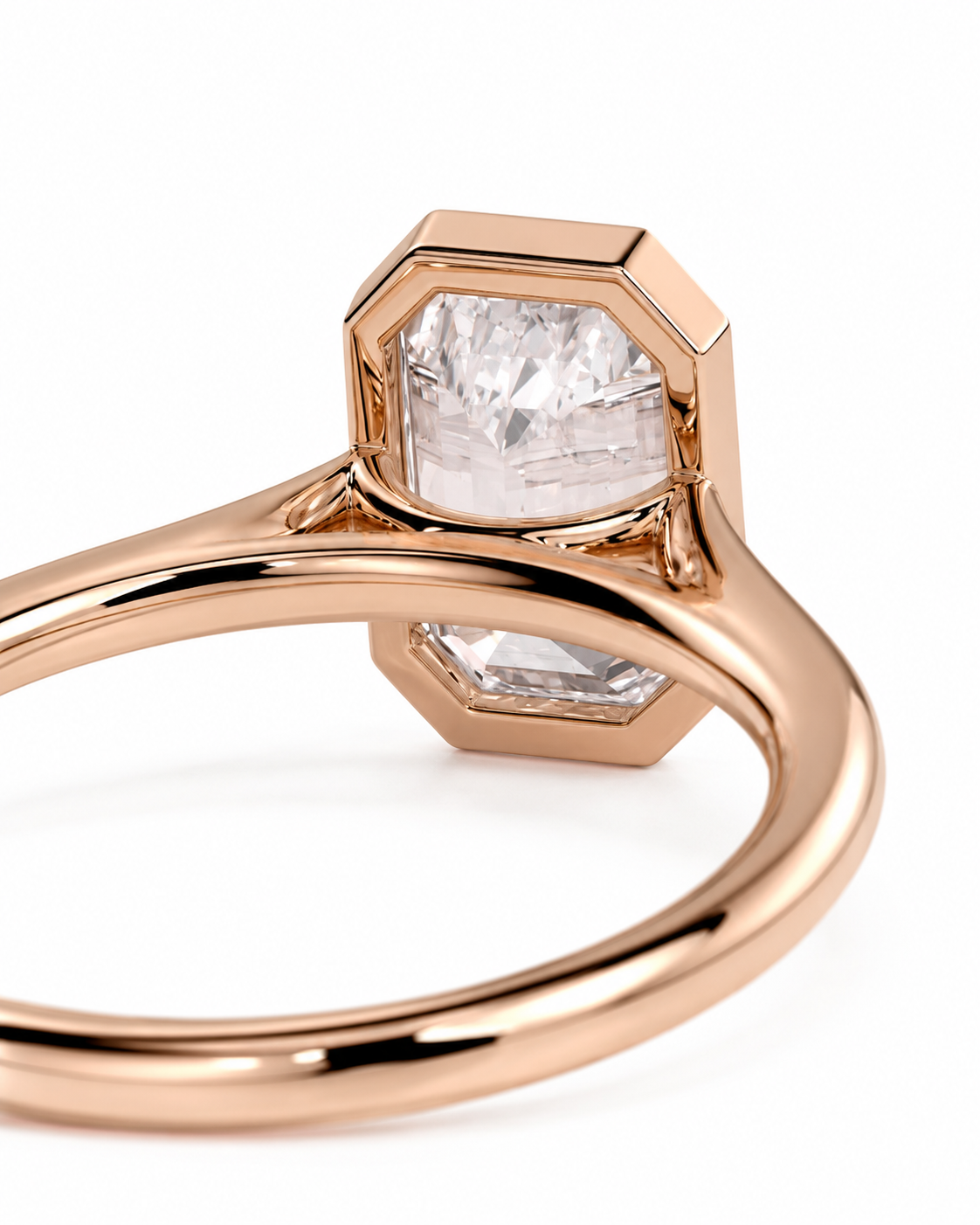 color_10K_RG, color_14K_RG &&A close-up of a rose gold ring featuring two hexagonal bezel settings holding clear baguette-cut gemstones, shown on a clean white background.