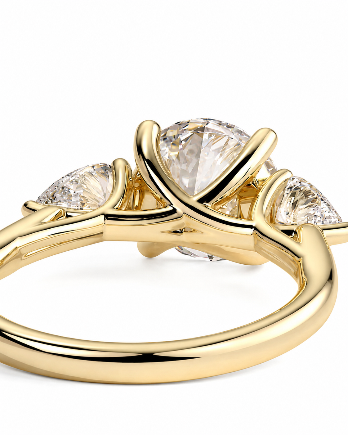 color_10K_YG, color_14K_YG &&
A close-up of a yellow gold ring featuring a large pear-cut center stone and two smaller marquise-cut side stones, set in a polished three-stone cluster design on a white background.