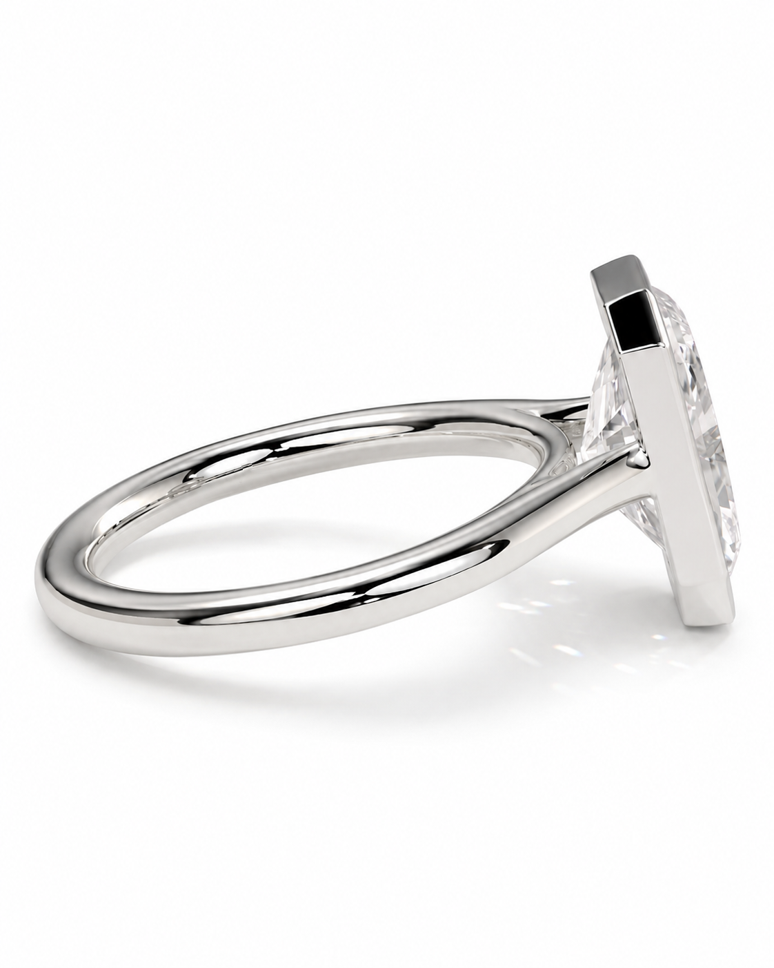 color_925_SIL,color_935_ARG,color_10K_WG, color_14K_WG &&A silver-toned ring with a wide, polished band and a rectangular prong setting holding a clear gemstone, shown on a white background.